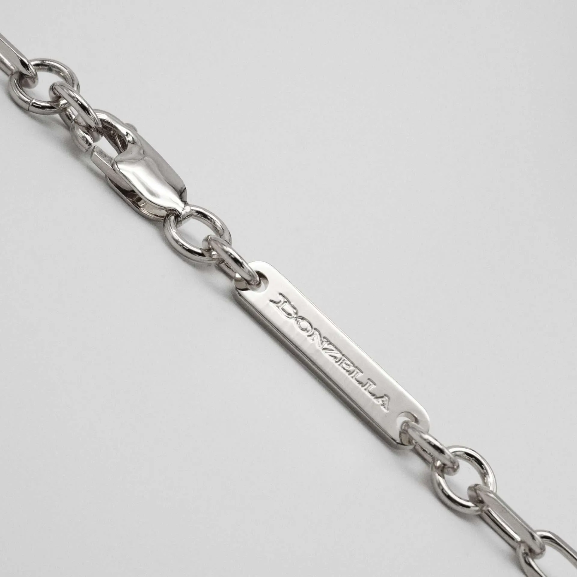 VERA NECKLACE | WHITE GOLD · tag detail