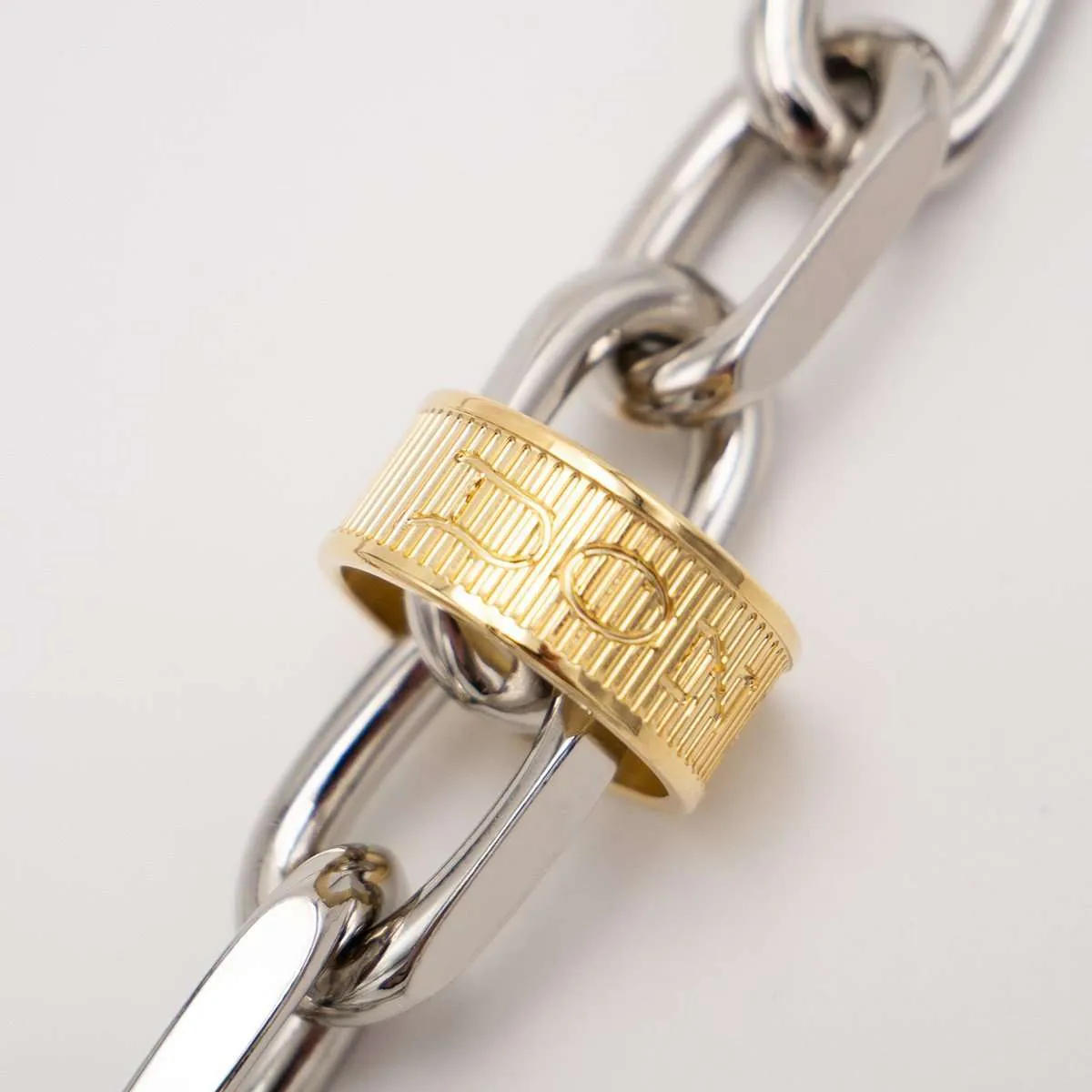 CLOSSER NECKLACE | WHITE GOLD · engraved ring detail